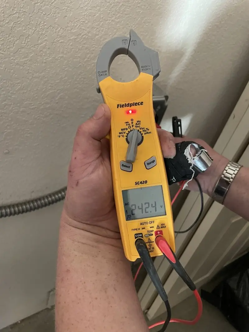 Voltage testing with clamp meter during Generator Installation in North Druid Hills